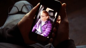 Gerald Begay, whose mother, Ella Mae Begay, went missing from her home, shows a photo of her on his phone in Denver, Thursday, April 2, 2026.