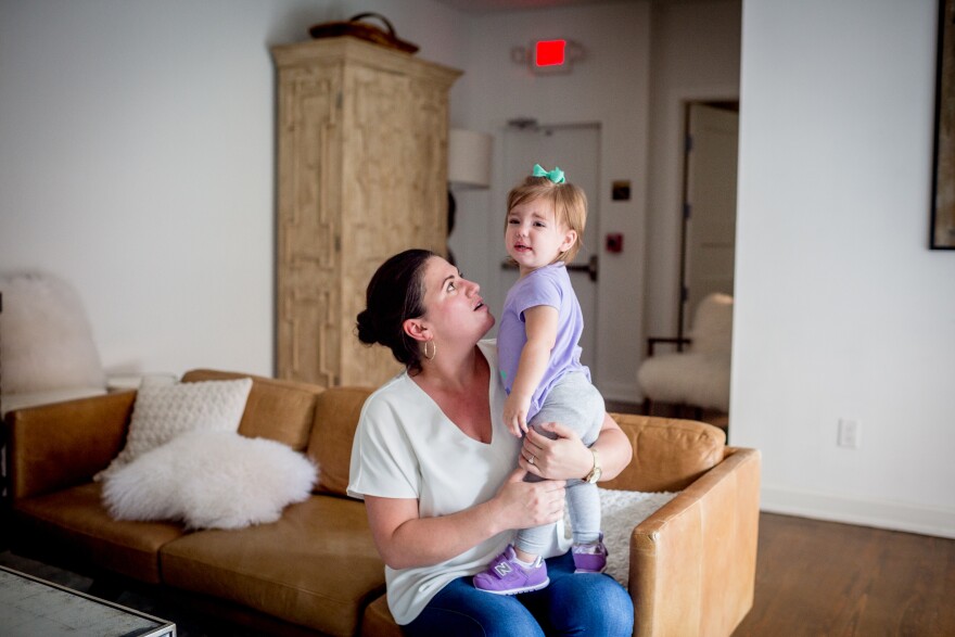 Shannon White holds her daughter, Stella. White's path to CEO was an unconventional one. She left college before getting her degree, then joined a Besh restaurant as a server, then manager.