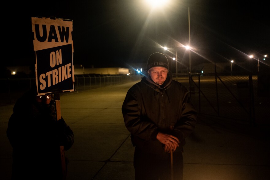 Nick, a former GM employee, stands with fellow strikers in front of the main truck gate at the Lordstown GM assembly plant, Lordstown, Ohio. Thursday, Oct. 17, 2019.