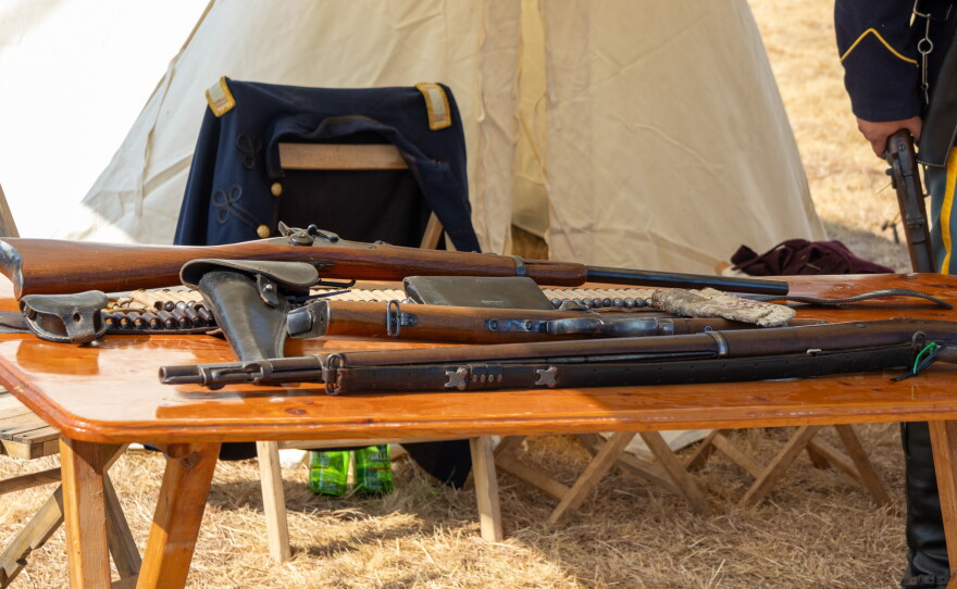Table with Civil War era muskets on it, photo by Alexander Brown.