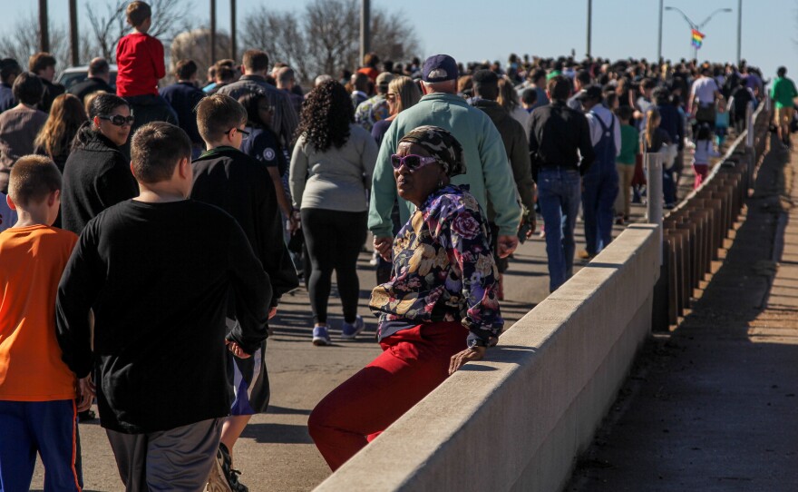 (Photo by Lydia Lawson) People walk across the Martin Luther King Jr. Bridge in Abilene on Monday, January 16, 2017. 