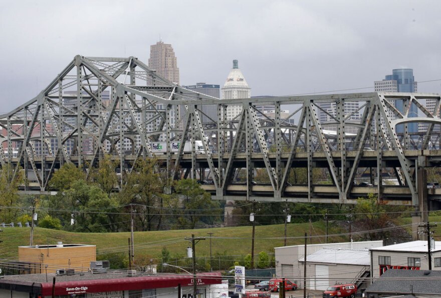 Traffic on the Brent Spence Bridge passes in front of the Cincinnati skyline while crossing the Ohio River to and from Covington, Ky. in this Oct. 7, 2014, file photo.