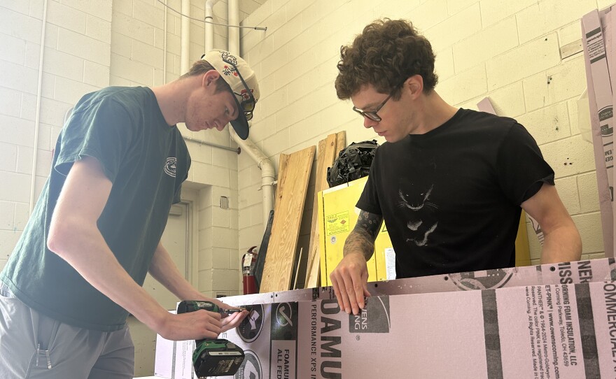 Virginia Peninsula Community College students Jonah Easley, left, and Austin Burke, craft a set piece on June 25, 2026, for the "America Made in Virginia: 250 Years Together" July 4th program at Colonial Williamsburg.