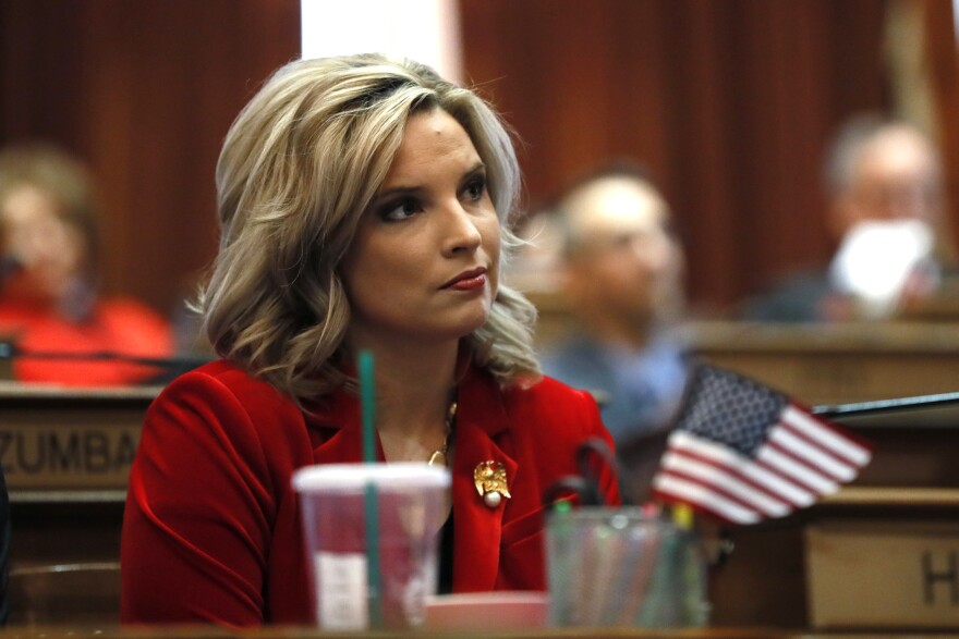 In this Jan. 13, 2020, file photo, State Rep. Ashley Hinson, R-Marion, watches as House Speaker Pat Grassley takes the oath of office during the opening day of the Iowa Legislature, at the Statehouse in Des Moines, Iowa. More Republican women than ever are seeking House seats this year after the 2018 election further diminished their limited ranks in Congress. But so far it appears that any gains this November could be modest.