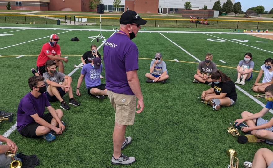 Valley Center High School band director Jan Verboom speaks to brass players after a morning band camp session. (Photo by Brian Grimmett, Kansas News Service)