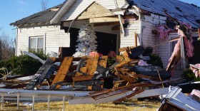 A Christmas tree still stands in a home that was severely damaged by a tornado in St. Charles County, near the community of Defiance. 
