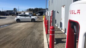 "Gassing up" Maine Public's electric vehicle, Pearl, in Jackman.