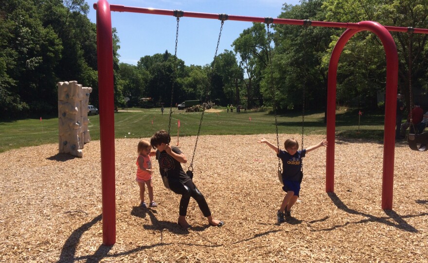 Children on swingset in Ormond Park.