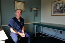 Ralph Northam sits in an exam room where he spends much of his time treating patients.