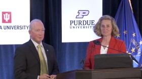 Purdue president Mitch Daniels (left) and Indiana University president Pamela Whitten (right) at Friday's announcement in Indianapolis.