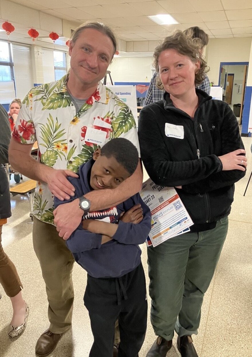 West Asheville residents Eli Day, Asia Heller and their 8-year-old son, Micah.