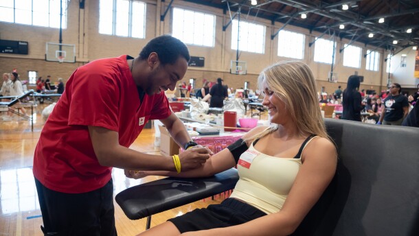Belle Red Cross phlebotomist prepares Belle Wilkins arm for her blood donation at the University of Missouri spring blood drive. Belle, who is studying nursing, started donating blood in high school. Photo by Jason Colston/American Red Cross
