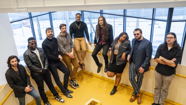 Nine-piece band Apostle Jones poses in a stairwell