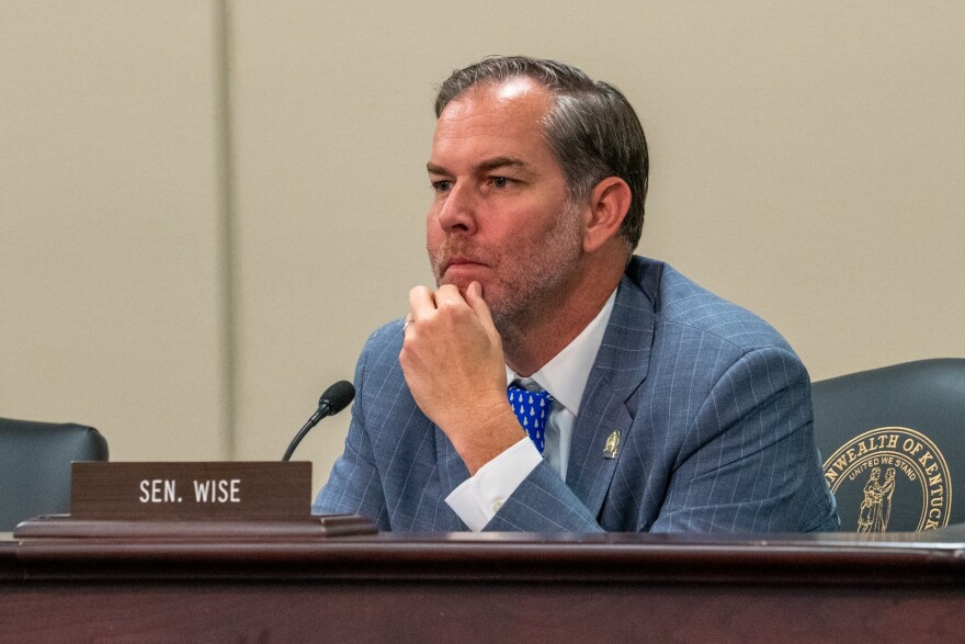 Senator Max Wise attends a meeting of the Senate Standing Committee on Education.