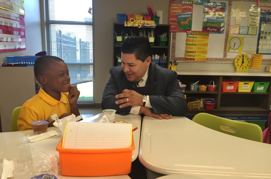 Superintendent Richard Carranza served breakfast to second-graders on the first day of school. The district is providing three free meals a day to all its 215,000 students this year because of Harvey.