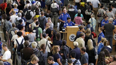 Lines of travelers snake past TSA agents at the Seattle-Tacoma International Airport last fall.