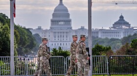 National Guard troops patrol the grounds of the Washington Monument with the Capitol seen in the distance as part of President Donald Trump's order to impose federal law enforcement in the nation's capital, in Washington, Thursday, Aug. 28, 2025. (AP Photo/J. Scott Applewhite)