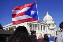 A woman waves the flag of Puerto Rico.