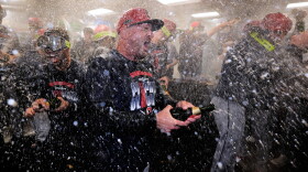 Cleveland Guardians manager Stephen Vogt center, celebrates with his team after clinching a post season playoff spot following a baseball game against the Boston Red Sox, Thursday, Sept. 24, 2026, in Boston.  
