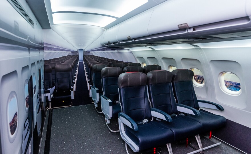 A replica of an airplane cabin in the sensory space includes airplane seats, trays, windows, seat belts and overhead compartments, to allow kids and adults to get used to the feeling of sitting on a plane.