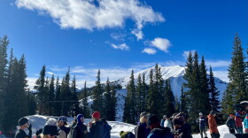 Volunteers gather near Loge Peak on Aspen Highlands for a day of “bootpacking” some of the ski area’s steepest terrain to mitigate avalanche danger on Nov. 18, 2023. The popular Highland Bowl, pictured in the background here, could be ready for opening day on Dec. 9, though a pending snowstorm may impact when some terrain opens.