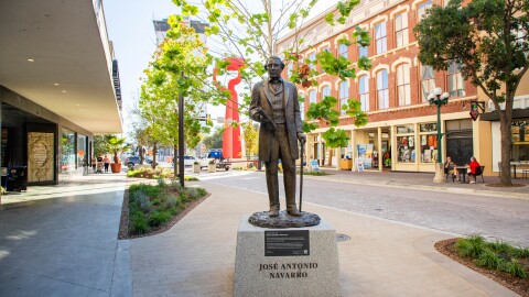 Statue of Texas Declaration of Independence signer Juan Navarro can be seen on the promenade with Torch of Friendship in the background on Nov. 21, 2025