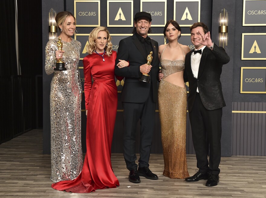 Sian Heder, from left, winner of the award for best adapted screenplay for "CODA", Marlee Matlin, Troy Kotsur, winner of the award for best performance by an actor in a supporting role for "CODA", Emilia Jones, and Daniel Durant pose in the press room at the Oscars on Sunday, March 27, 2022, at the Dolby Theatre in Los Angeles. (Photo by Jordan Strauss/Invision/AP)