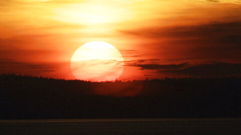 The sun sets over Eliott Bay, Friday, Jan. 13, 2012, in Seattle. 