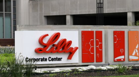 FILE - This April 26, 2017 file photo shows the Eli Lilly & Co. corporate headquarters in Indianapolis. Shares of Eli Lilly jumped after the drugmaker laid out a better-than-expected revenue forecast and plans to buy a young company developing a potential Parkinson’s disease treatment.