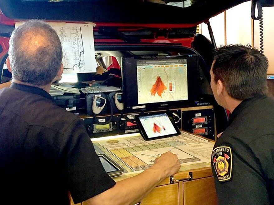 Los Angeles Fire Department staff look at a new fire prediction tool, powered by supercomputers.