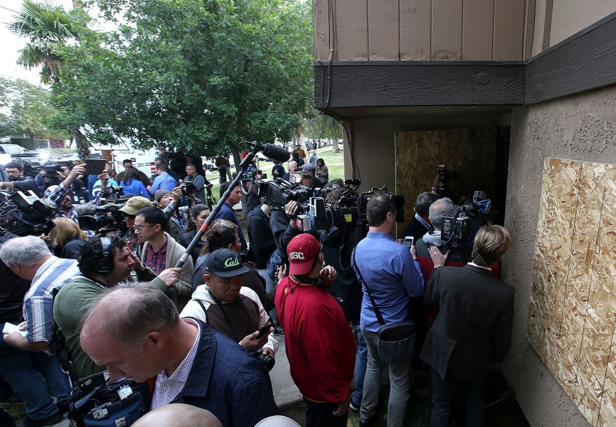 Dozens of members of the media stand in front of the home of shooting suspects Syed Farook and Tashfeen Malik on Friday.