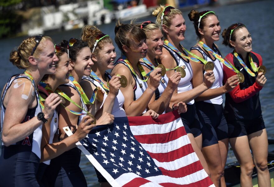 (Left to right) Emily Regan, Kerry Simmonds, Amanda Polk, Lauren Schmetterling, Tessa Gobbo, Meghan Musnicki, Eleanor Logan, Amanda Elmore and Katelin Snyder of the U.S. pose with their gold medals on the podium of the Women's Eight final rowing competition on Saturday.