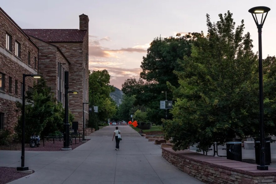 A person walks through the campus of the University of Colorado Boulder, Tuesday, July 14, 2026, in Boulder. (