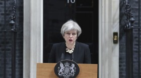 Britain's Prime Minister Theresa May makes a statement in Downing Street, London, after chairing a meeting of the Government's emergency Cobra committee following Saturday night's terrorist incident in London. Several people were killed in the terror attack at the heart of London and dozens injured. The prime minister called for a tougher stance at home against extremists. (Andrew Matthews/PA via AP)