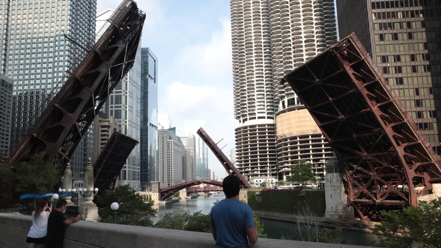 Bridges that lead into downtown Chicago were raised to limit access after looting and vandalism late Sunday and early Monday. Police made more than 100 arrests during the night of unrest and confiscated five guns.