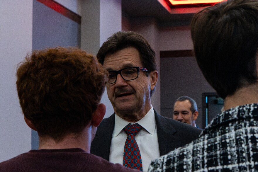 Texas Tech University President Lawrence Schovanec speaks with protest organizer James Snoddy after the board of regents meeting on May 7, 2026.