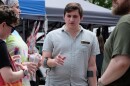 New Hampshire State Rep. Heath Howard, who is running for Congress, speaks with voters during Rochester Pride on Aug. 1, 2026.