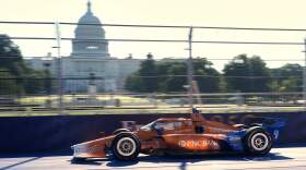 Race car driver Scott Dixon drives his car early for practice near the U.S. Capitol before the IndyCar Freedom 250 Grand Prix auto race in Washington, Sunday, Aug. 23, 2026. (AP Photo/Alex Brandon)