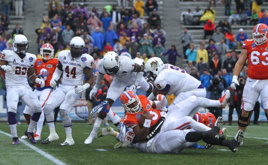 The ECU defense sacks Florida quarterback Treon Harris.