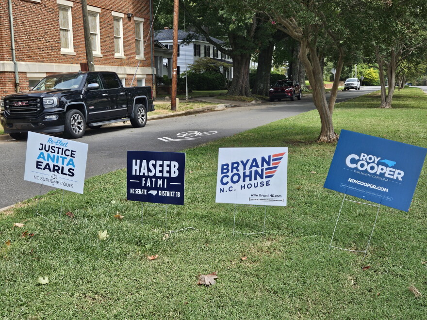 Campaign signs for Democrats line a street in downtown Oxford.