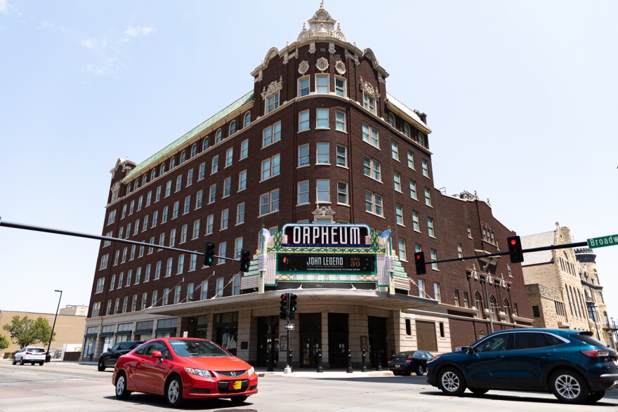 The Orpheum Theater's marquee sign announcing John Legend's performance at the theater's grand reopening.