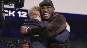 Alabama offensive lineman Tyler Booker, right, celebrates with NFL Commissioner Roger Goodell after being chosen by the Dallas Cowboys with the 12th overall pick during the first round of the NFL football draft, Thursday, April 24, 2025, in Green Bay, Wis.