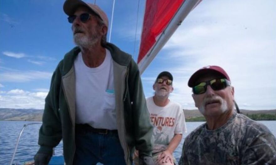 Jason Essington (center) races Opa's Dream with crewmates Dave Payne (left) and Terry Van Valkenburg (right).
