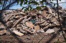 Piles of concrete and brick line a fence separating the former Pruitt-Igoe housing development from the Gateway school complex. Parents and staff at the school say placing the rubble there stirred levels of dust high enough to sicken students and teachers