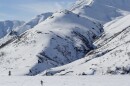 Sam Sterling skis over a crusty layer of snow in the mountains off the Denali Highway in Interior Alaska this month.