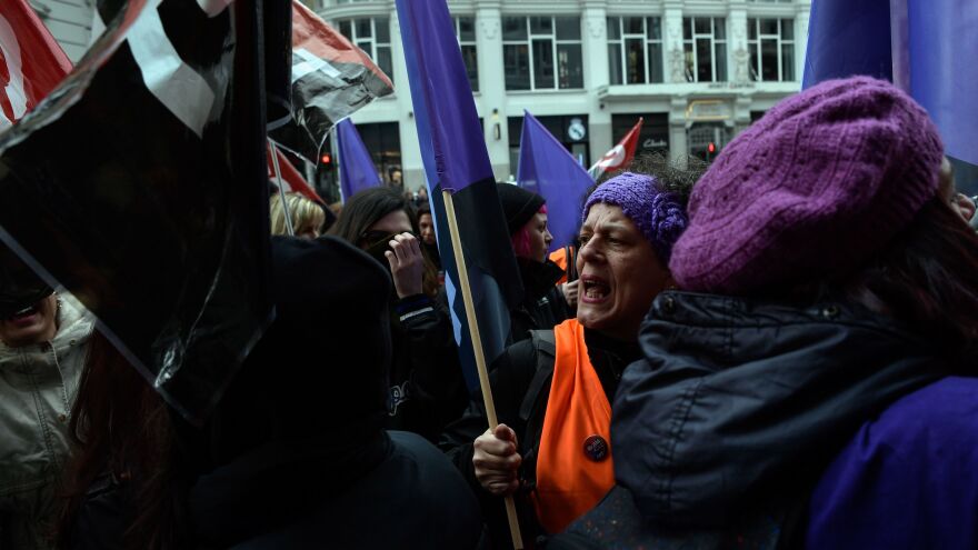 Picketers flooded a clothing store in Madrid during a one-day strike to defend women's rights on Thursday. The walkout called by unions asked women not to spend money and to ditch their domestic chores for the day.