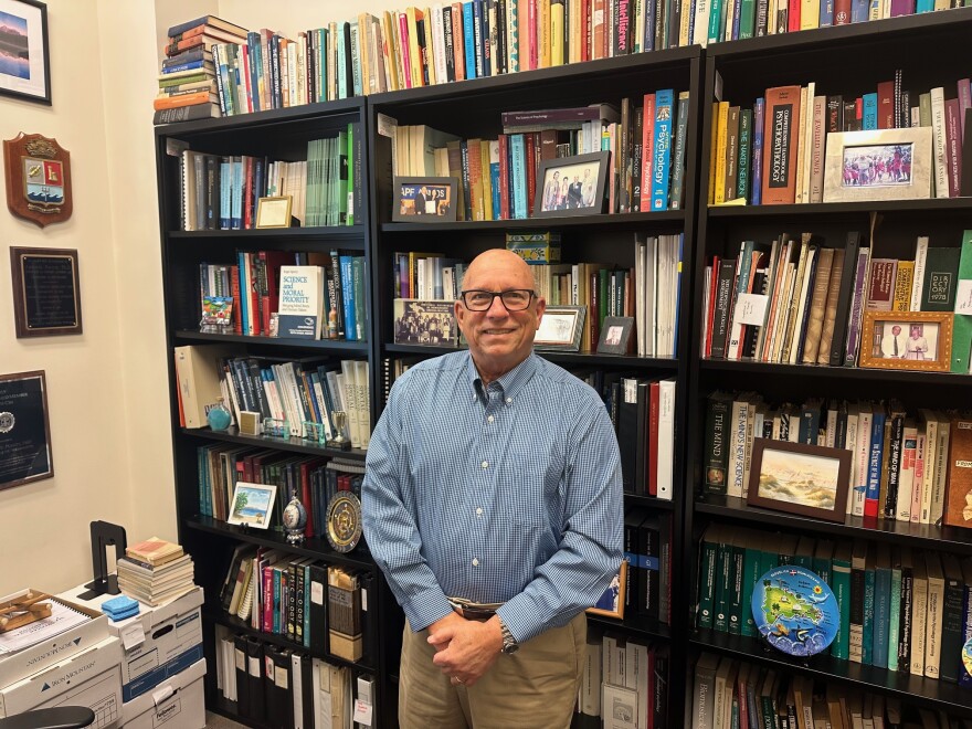 UNCW professor Dr. Antonio Puente pictured in his office. He said the biggest fault of Centro Hispano was "our success." 