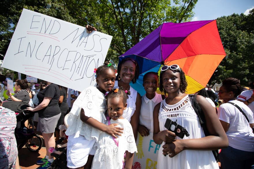 Anna McCall saw the protest as an opportunity to teach her daughters Amina, Makeda, Adama and Kamara about civic engagement.