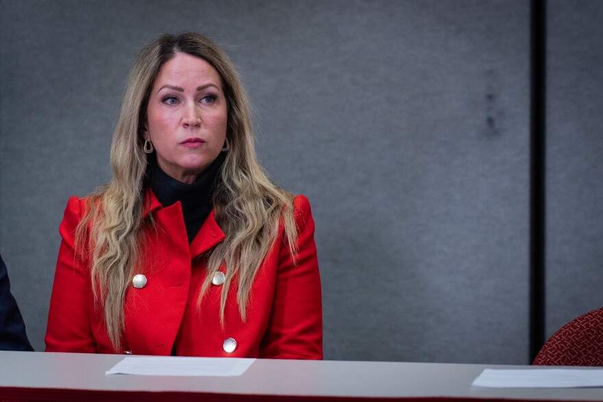 Laura Ah Loo, the widow of Ah Loo, sits next to her attorneys during a news conference at the Utah State Bar, March 9, 2026. Months after prosecutors decided who to charge in her husband’s death, Ah Loo and her family are bringing a civil suit against several individuals, including those involved in organizing the protest.