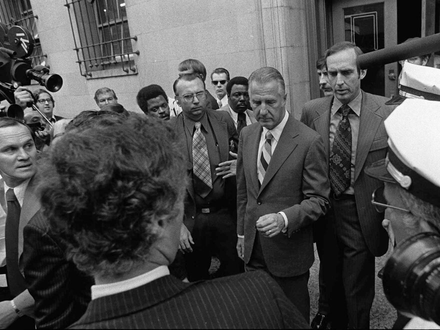 Spiro T. Agnew (center) pleaded no contest to a charge of income tax evasion — after attacks against the judicial system. Agnew resigned from the vice presidency.